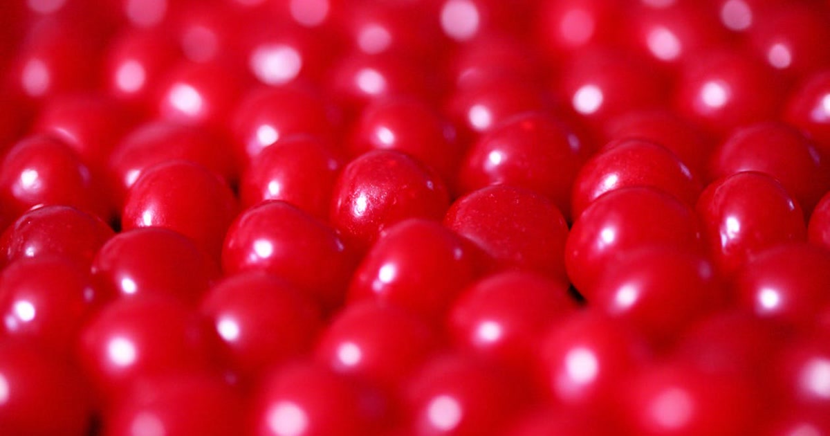 Red 40 (Allura Red AC, E129) food dye coloring bright red candies, jellybeans, and sugary drinks